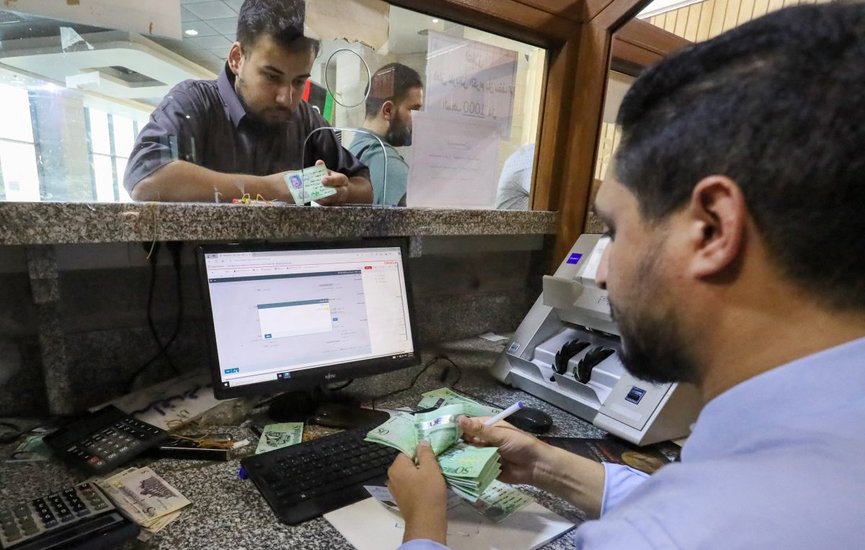 AFP__20240903__36FE47F__v1__HighRes__LibyaConflictEconomyBanking-1200x800