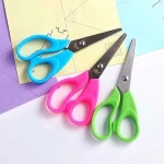 Learning to buy an scissors school supplies from zero to one hundred