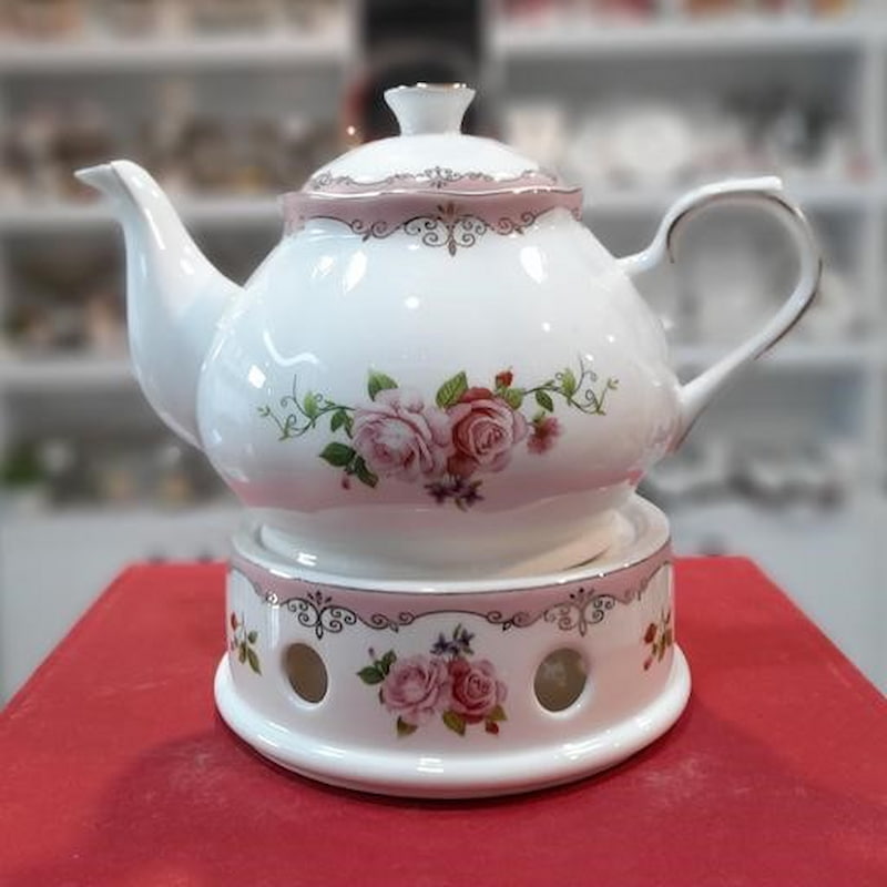 قوری چینی تزیینی teapot دارای طراحی ظریف جهت دم کردن دمنوش