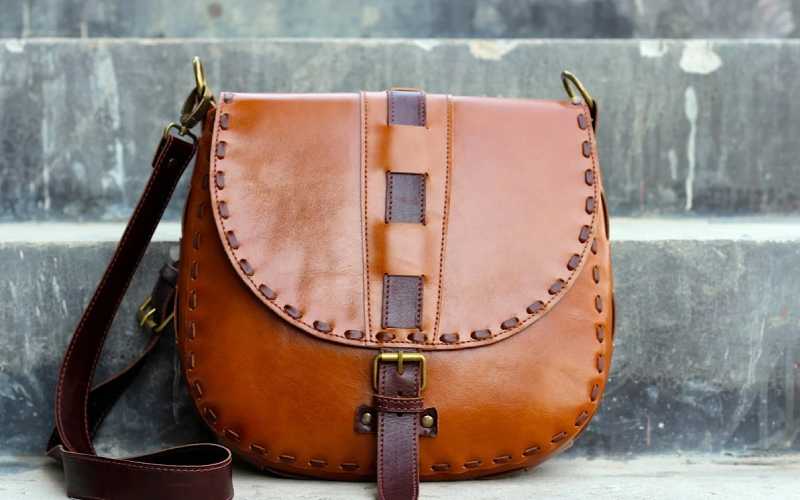 کیف چرم زنانه دست دوز؛ زیپی دکمه ای گاوی بزی گوسفندی