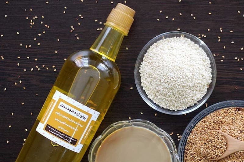 روغن ارده کنجد یک لیتری؛ زرد شفاف حاوی مواد معدنی ویتامین تولید Yazd