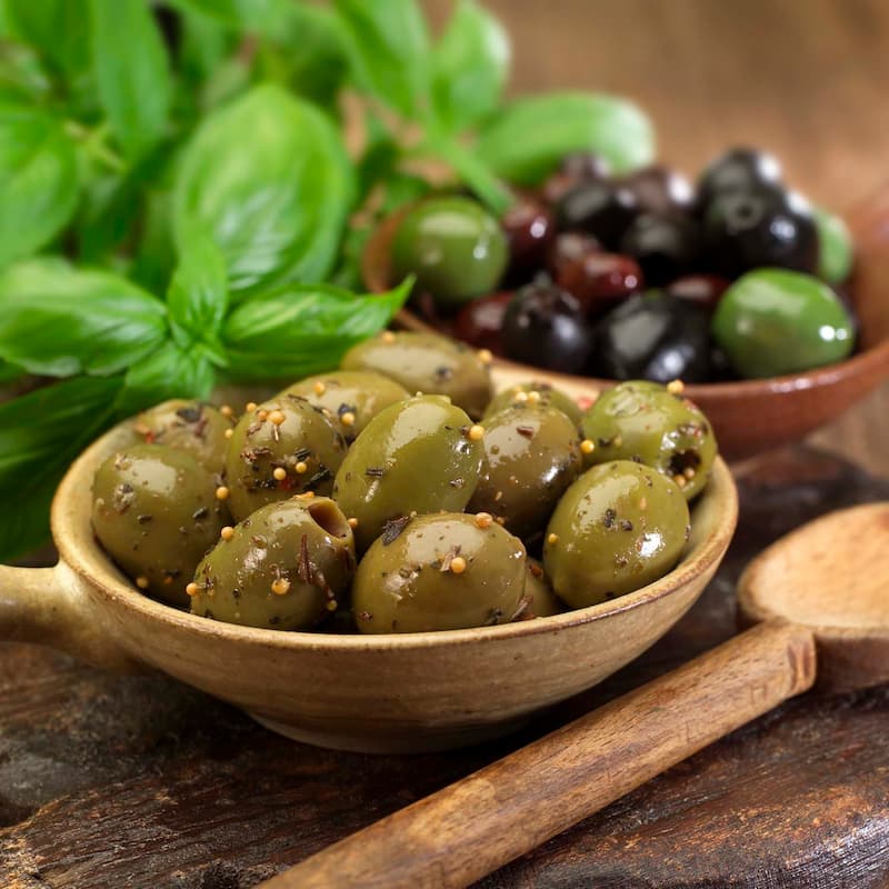 زیتون طعم دار؛ سیاه سبز ترش شیرین ملس (100 700) گرمی