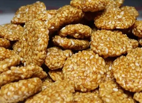 قیمت خرید پولکی کنجدی ساده + طرز تهیه