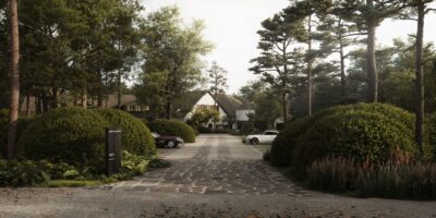 Tree-lined driveway leading into the wooded grounds of the priory