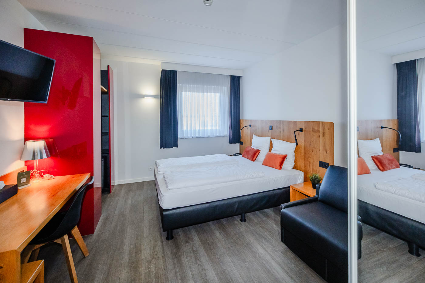 Modern hotel room with atmospheric decor at Corsendonk Viane