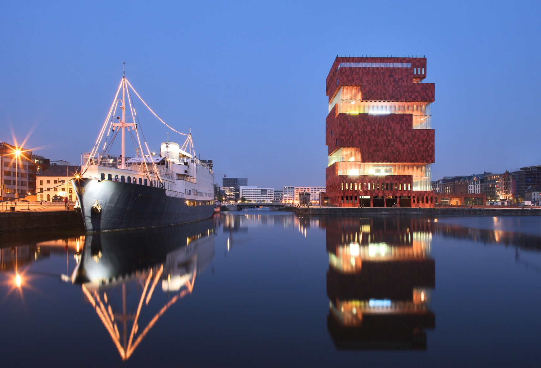 Historic ship on the waterfront with the MAS museum behind it