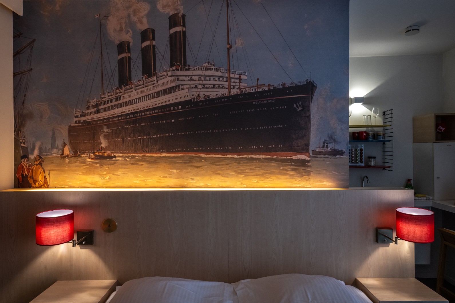 Red Star Line Room with dramatic ship mural and red bedside lamps