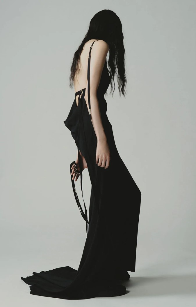 Fashion portrait in a black backless dress