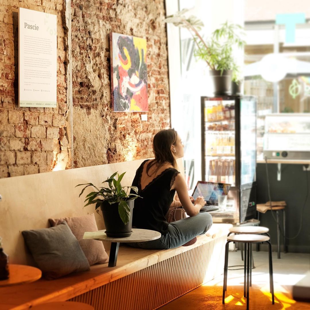 Guest working on a laptop in the brick lounge