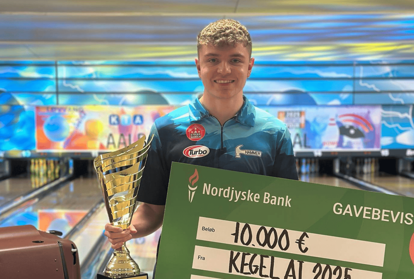 Ben Robinson with a Allborg International trophy