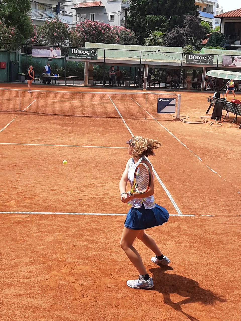 Alexandra Giannadaki palying tennis in Greece