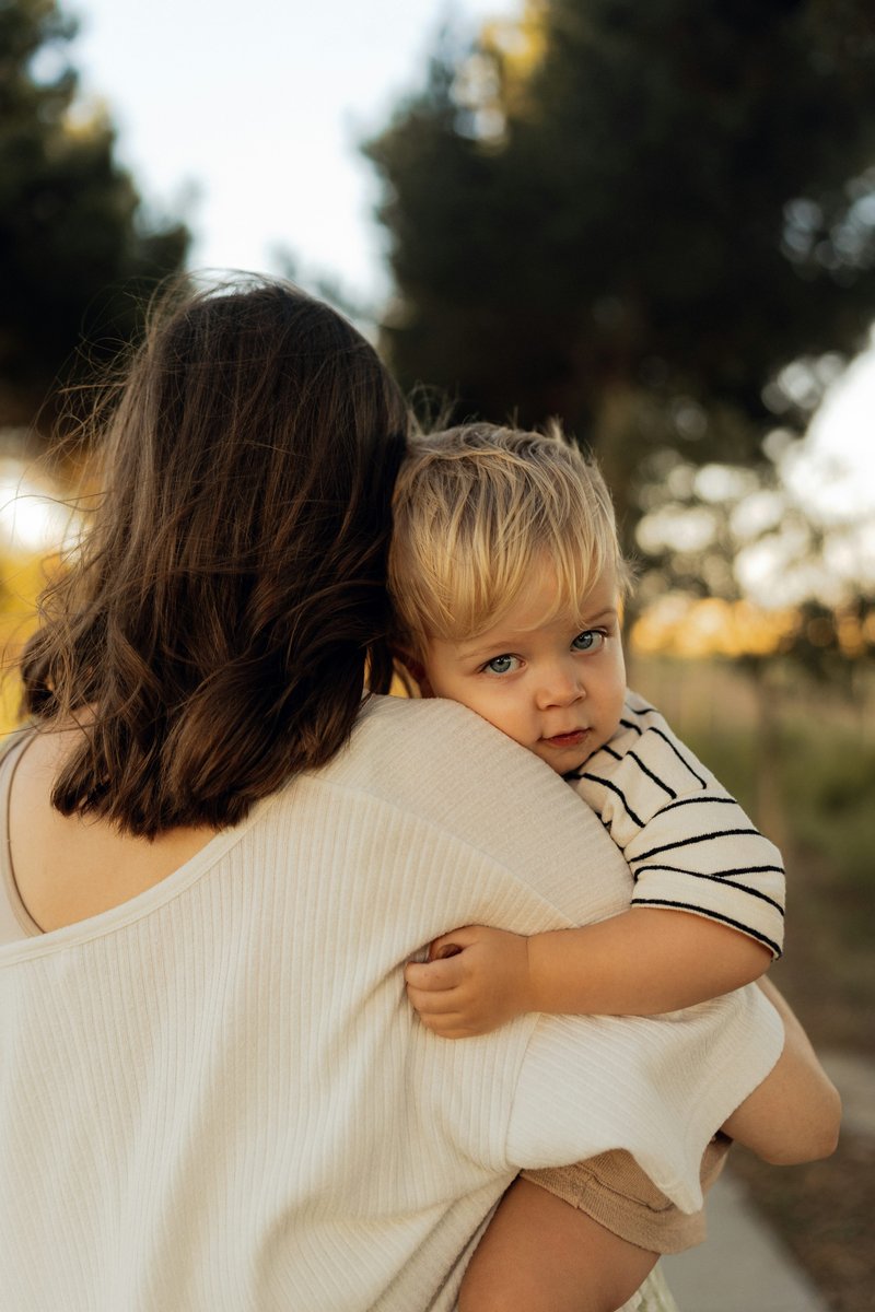 A woman holding a baby in her arms photo – Free Image on ...