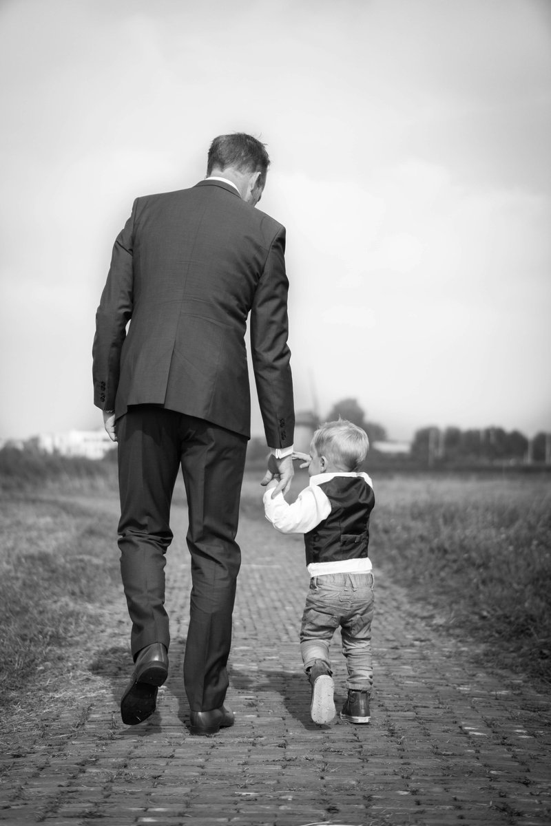 Man walking holding boy photo – Free Family Image on Unsplash