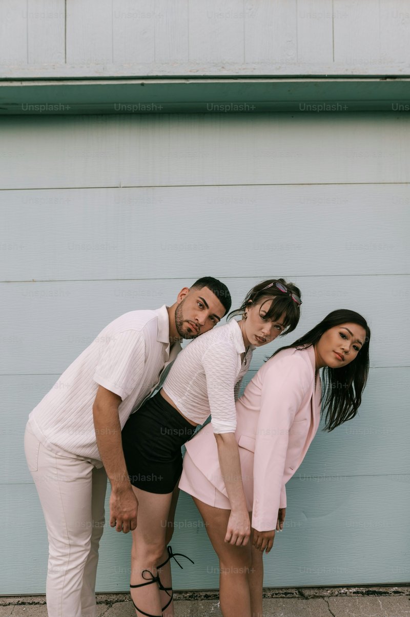 A man and two women standing next to each other photo – Style Image on Unsplash