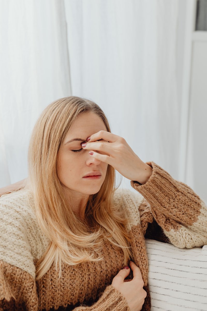 Woman Holding Her Nose Because of Sinus Pain · Free Stock Photo