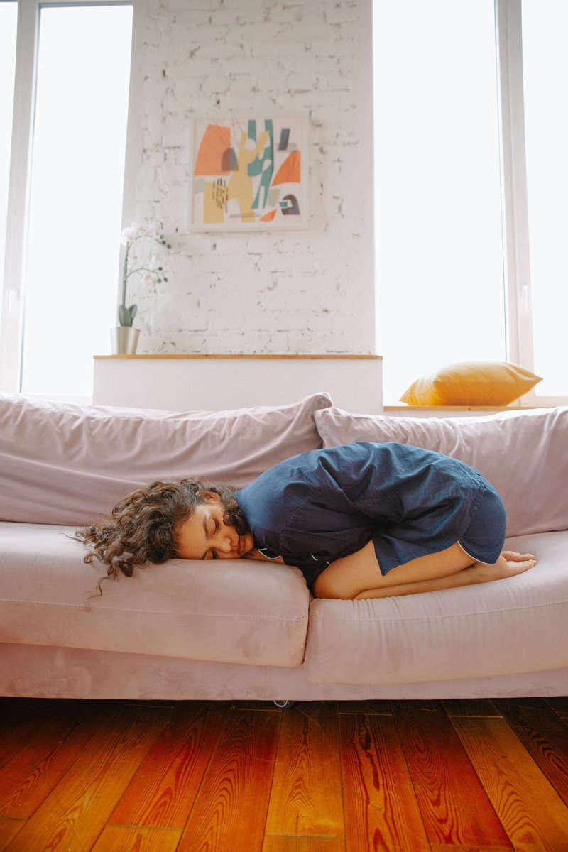 Woman Suffering from a Stomach Pain · Free Stock Photo