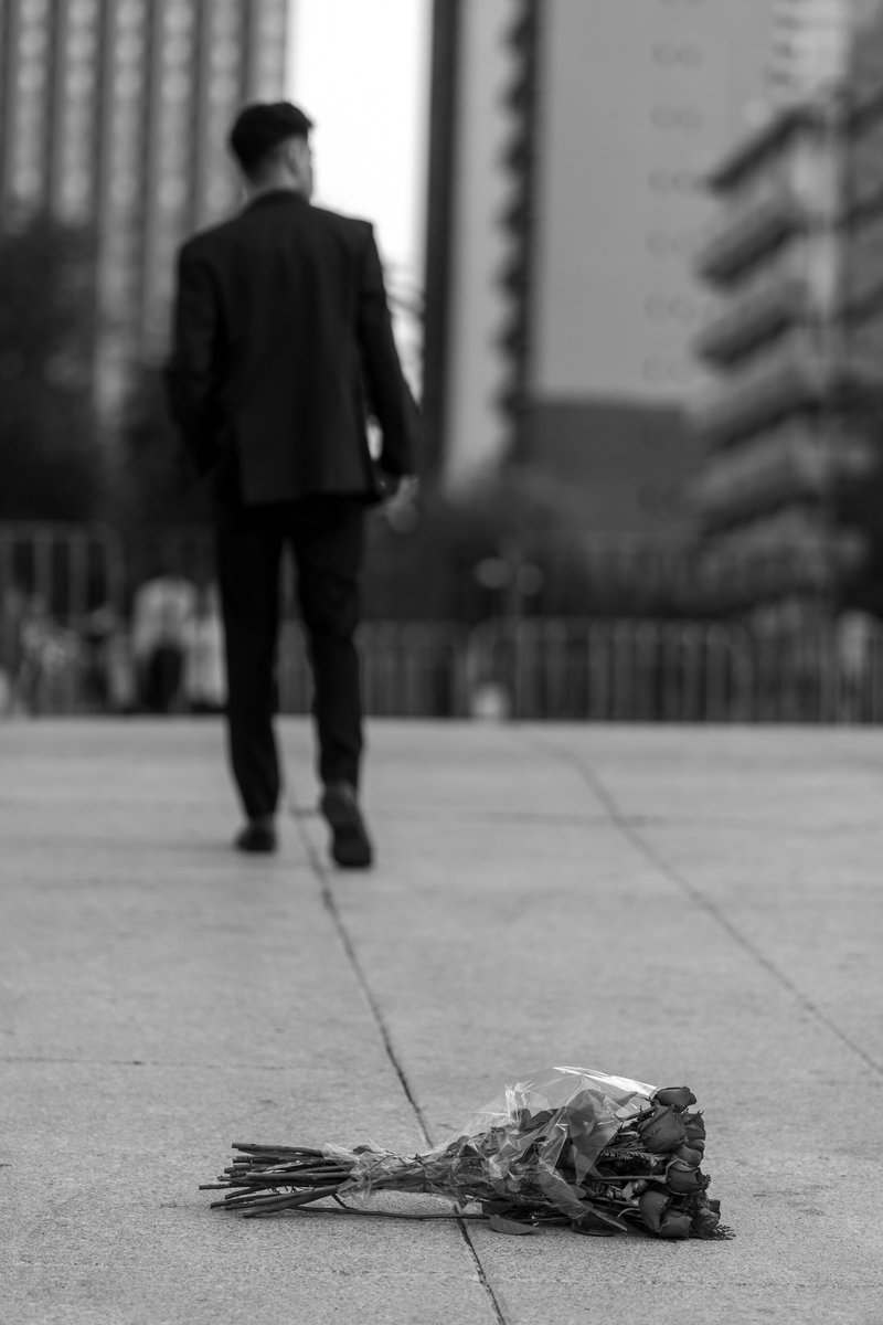 Man Walking Away from Bouquet in Mexico City · Free Stock Photo