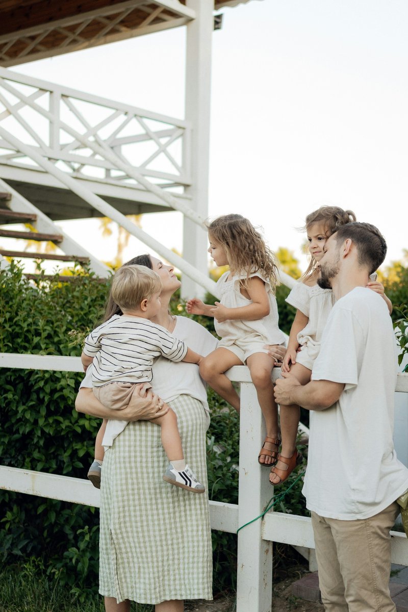 Family enjoying time together on a porch. photo – Free White ...