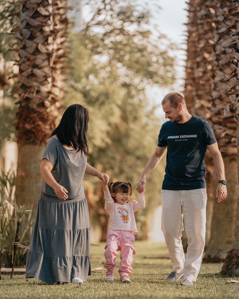 Happy Family Enjoying a Day in the Park · Free Stock Photo