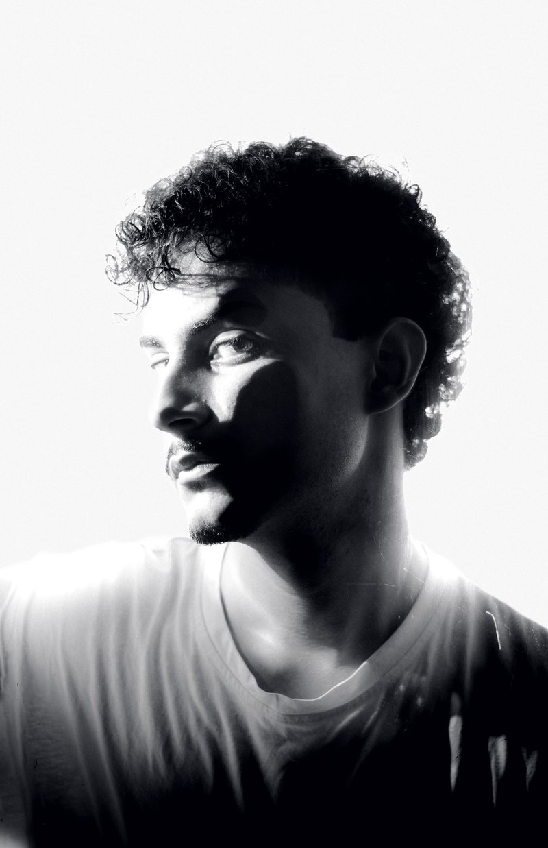 Partial Silhouette of a Man in a White Shirt · Free Stock Photo