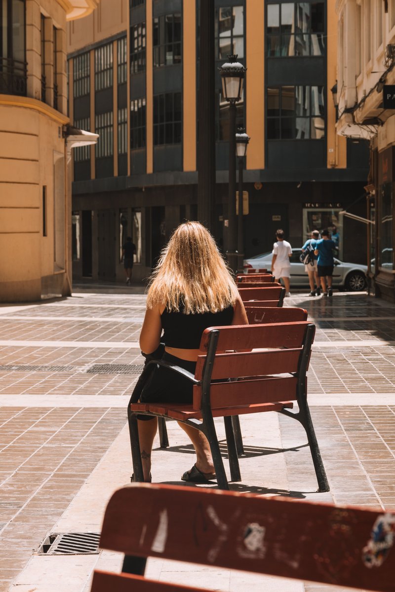 Woman Sitting Alone in the City · Free Stock Photo