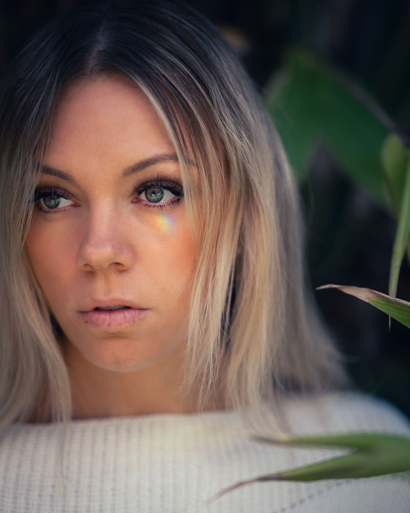 Sad woman with blond hair looking down · Free Stock Photo