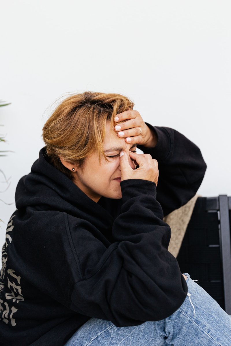 A Woman Feeling Pain on Her Nose · Free Stock Photo