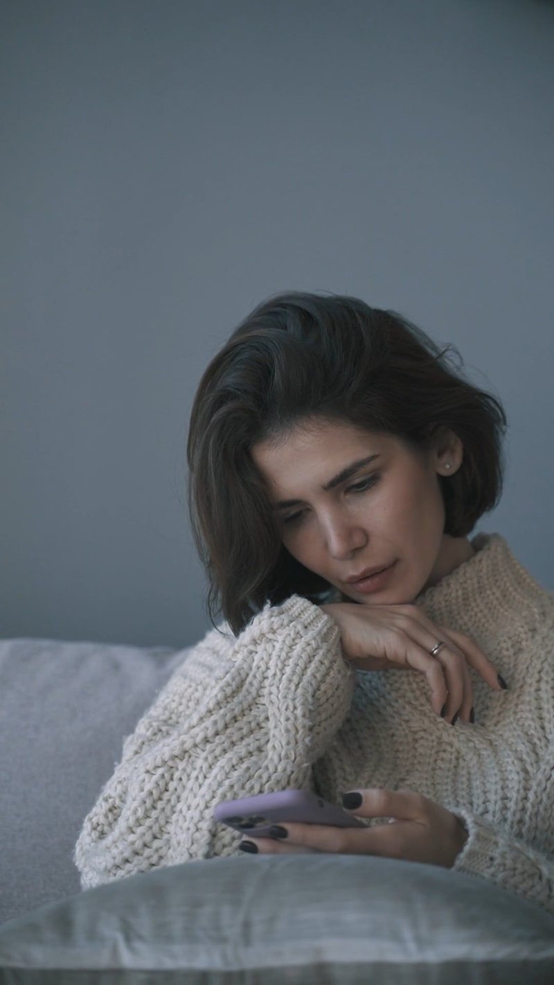 Sad Woman Using her Mobile Phone Free Stock Video Footage, Royalty-Free 4K & HD Video Clip