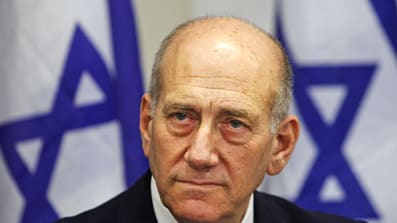 Ex-Israel PM cancels Swiss trip, fearing arrest for war crimes