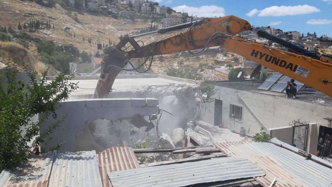 'Israel' forces family to demolish house of handicapped mother