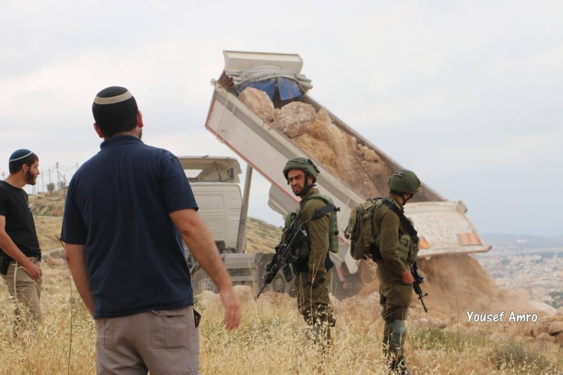 Israeli settlers level agricultural land in Hebron