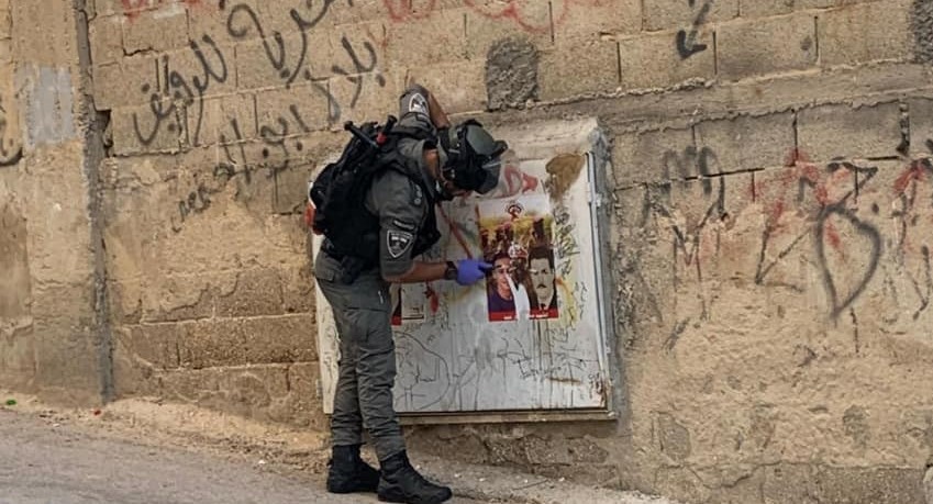 Pictures| Israeli army raids Issawiyyeh to remove posters of young Palestinian it killed last year