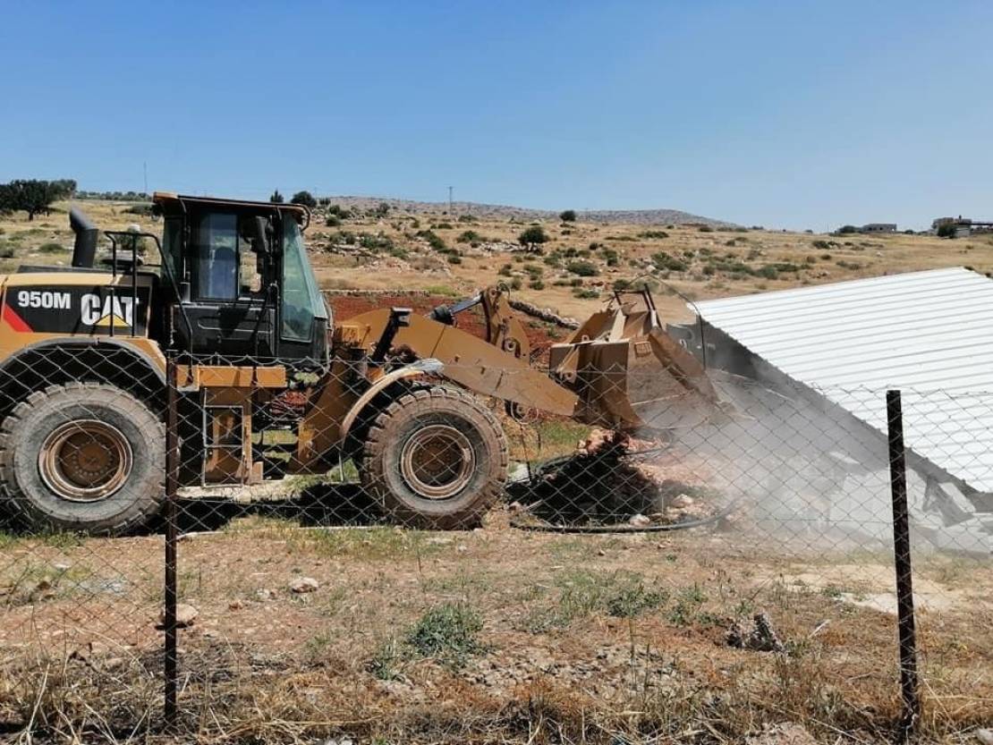 Israeli bulldozers demolish agricultural room, water well, two houses, livestock shelter in Hebron