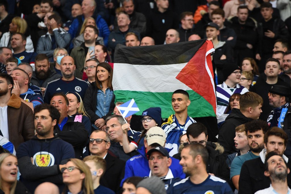 Pro-Palestine activists display Palestinian flag during Scotland's World Cup qualifier match