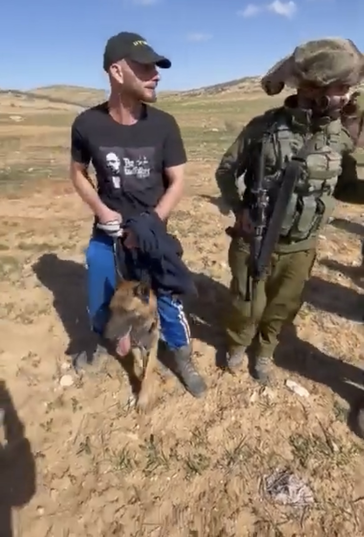 Israeli settlers, backed by soldiers, attack Palestinian shepherd and his dog in Khirbet Zanutah