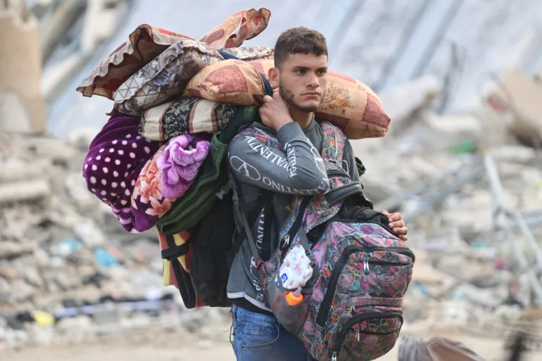 In Pictures: With no safe place to go, Palestinians flee Jabalia amid deadly Israeli attacks