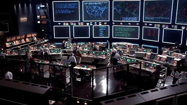a huge space styled like nasa mission control with banks of dozens of conputer terminals facing a wall of enormous bright back-projection screens - apparently the most expensive movie set up to that time