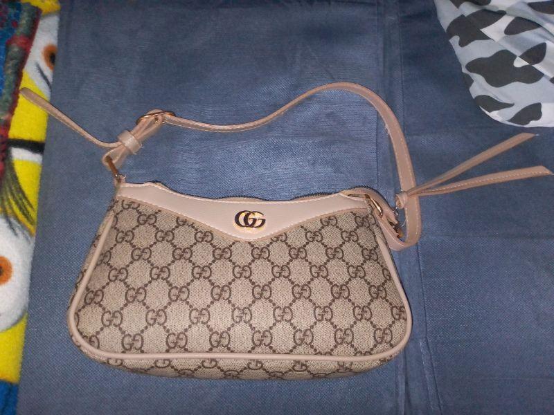 Gucci Handtasche.