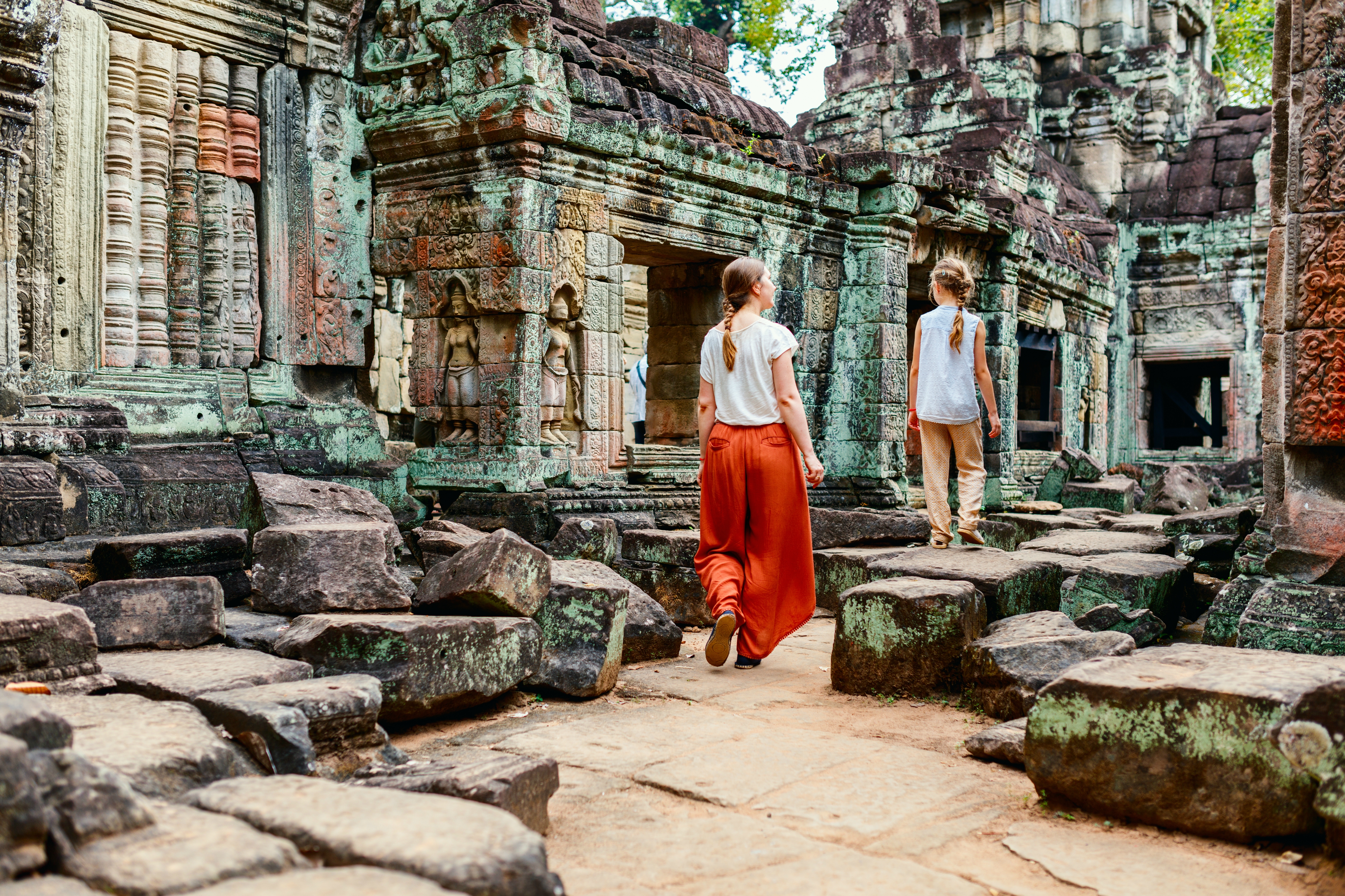 Family visiting Preah Khan temple in Angkor Archeological area in Cambodja