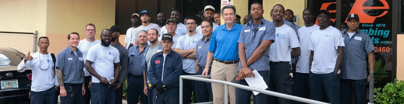 The Plumbing Experts team outside the office