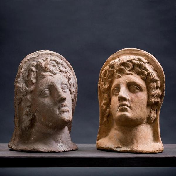 Two Etruscan terracotta votive heads of a youth. Cerveteri 3 century BC.