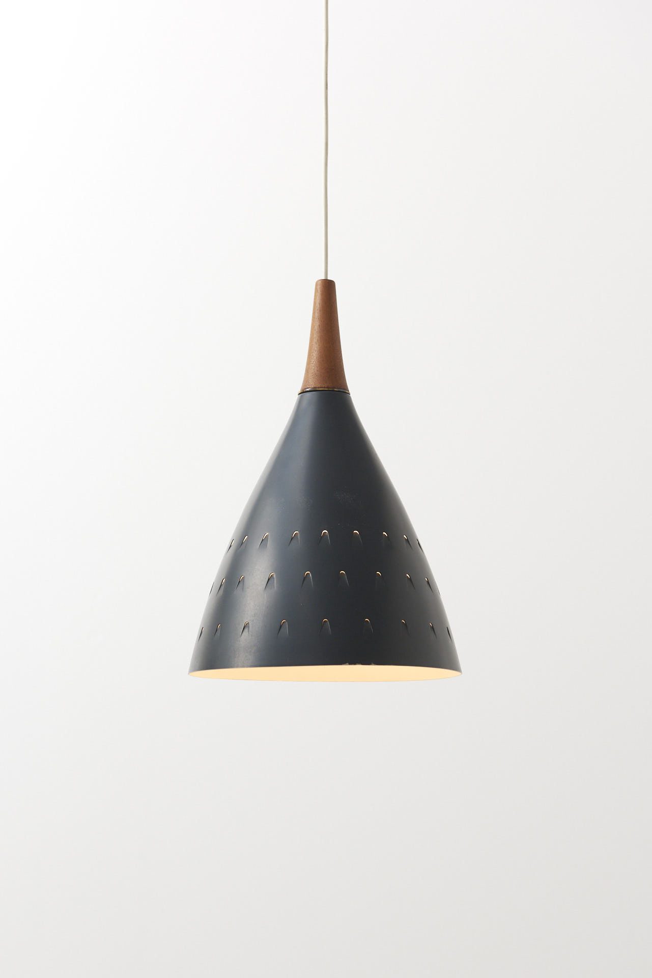 Pendant lamp with perforated metal shade