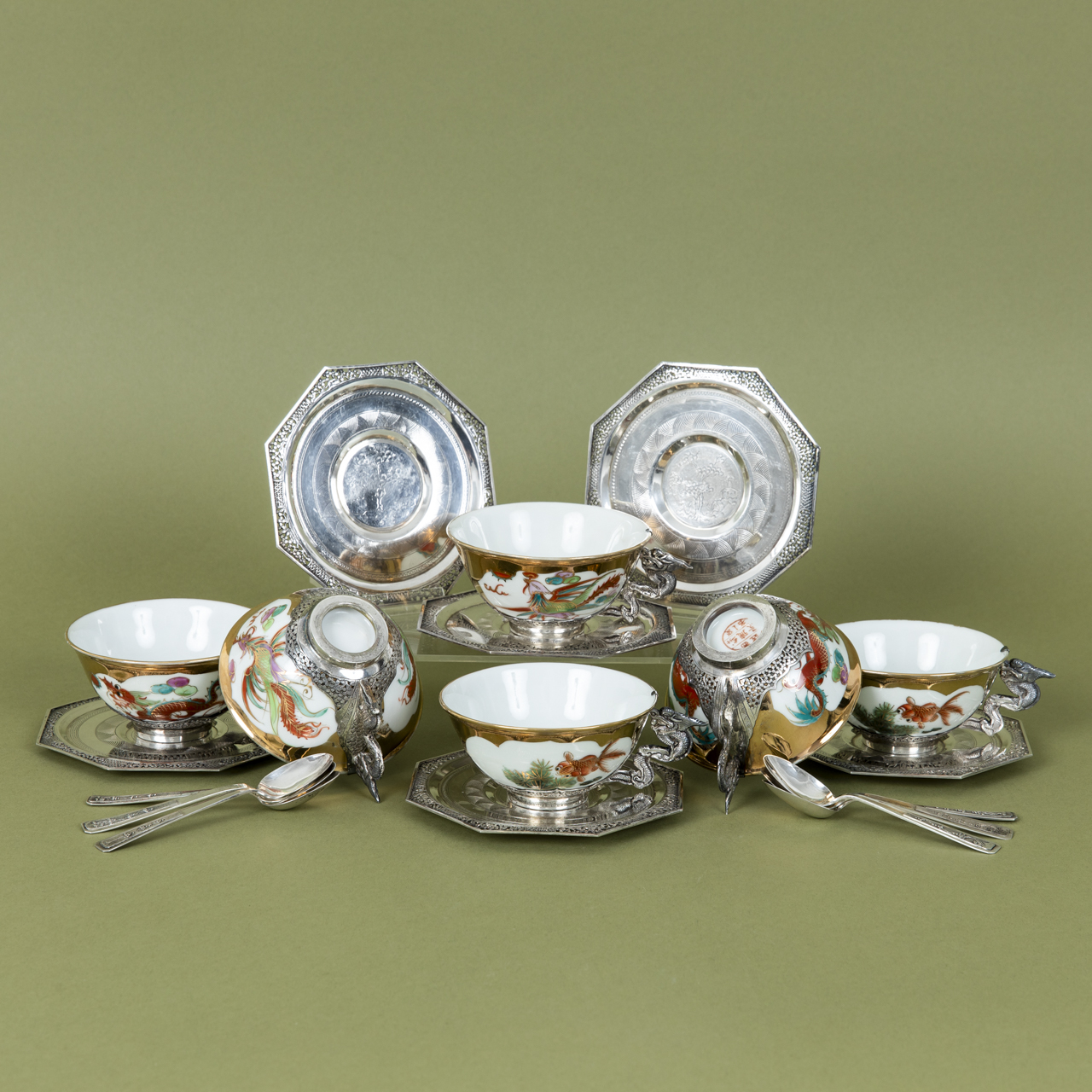 Porcelain Teacups with Silver Mounts and Spoons