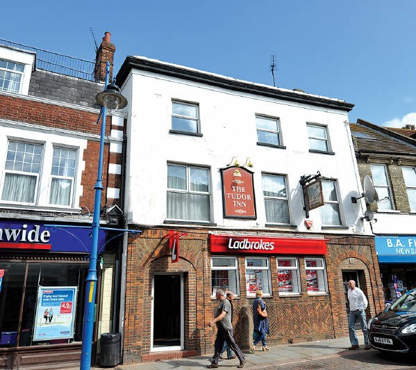 Freehold Town Centre Betting Shop Investment with Vacant Upper Floors