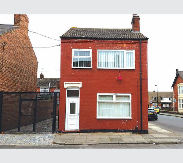 A Freehold End of Terrace Building internally arranged to provide Two Self-Contained Flats, One subj