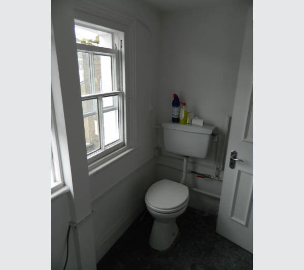 A Freehold Part Reversionary Ground Rent Investment secured upon a Mid Terrace Building arranged to 