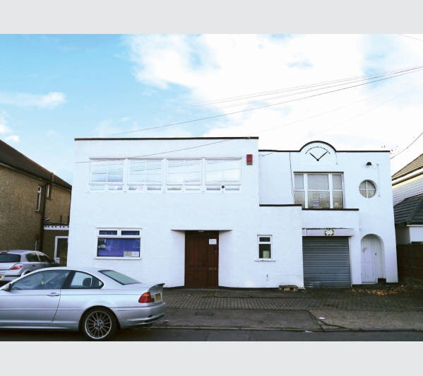 A Freehold Commercial Building located within a predominantly Residential Area