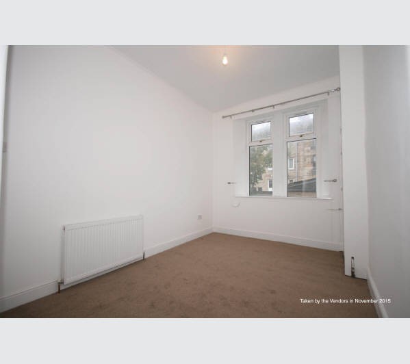 A Scottish Heritable Self-Contained Purpose Built Ground Floor Tenement Flat subject to a Short Assu