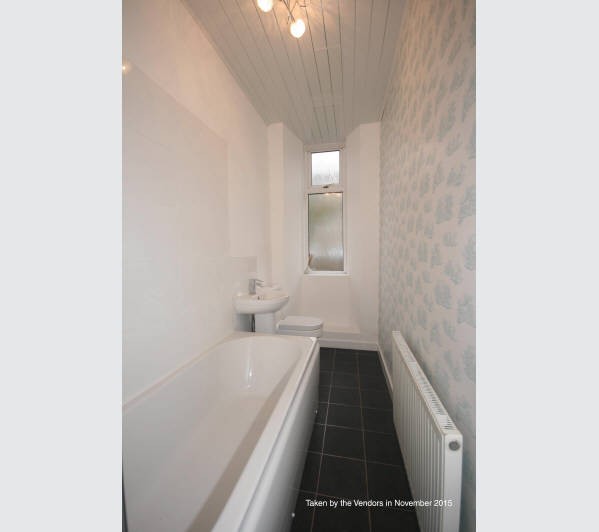 A Scottish Heritable Self-Contained Purpose Built Ground Floor Tenement Flat subject to a Short Assu