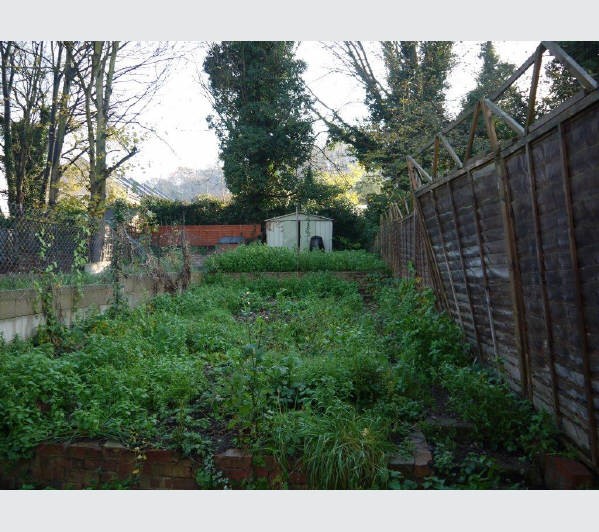 A Freehold Mid Terrace House (Shell Condition) with Garden